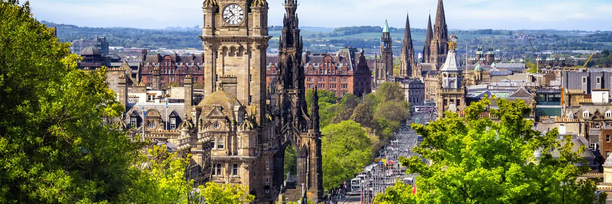 A towering clock tower overlooking a cityscape.